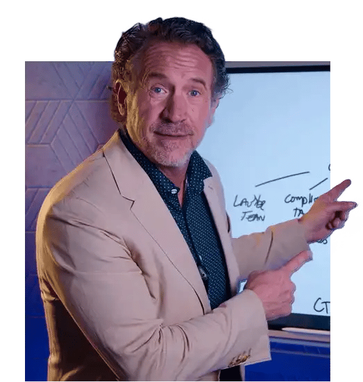 Mark J Kohler pointing at a white board